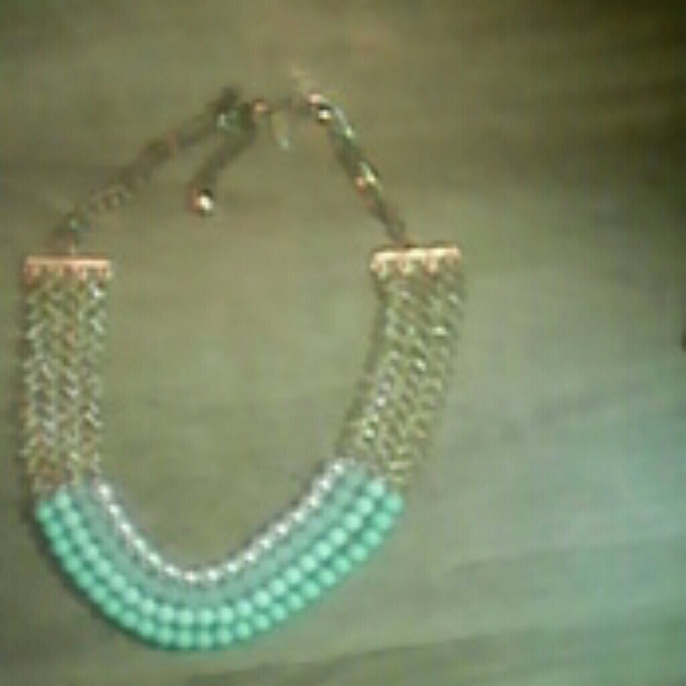 Cara.     New York. Necklace